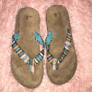 Gently worn Sanuk “Fraidy Cat” flip flops